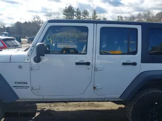 2013 Jeep Wrangler Unlimited Sport with VIN 1C4BJWDG1DL695934, listed as a IAAI auction lot 41691295 with 141,627 mi miles. Bid and sale history available at carsss.com. Image 14.
