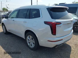 2023 Cadillac XT6 FWD Luxury z VIN 1GYKPAR4XPZ182533, wystawiony jako IAAI lot #42078937 z przebiegiem 31 248 mil mil oraz . Historia ofert i sprzedaży dostępna na DreamBid. Obrazek 3.