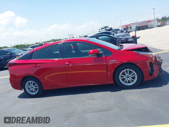 2021 Toyota Prius L Eco with VIN JTDKAMFU4M3145215, listed as a IAAI auction lot 42281566 with 74,220 mi miles and . Bid and sale history available at DreamBid. Image 12.