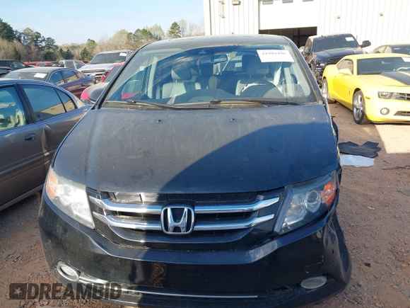 2014 Honda Odyssey Touring with VIN 5FNRL5H90EB077054, listed as a IAAI auction lot 41904456 with 197,869 mi miles and . Bid and sale history available at carsss.com. Image 12.
