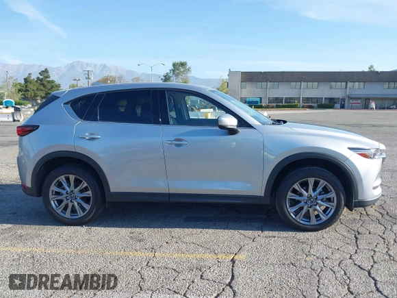 2021 Mazda CX-5 Grand Touring with VIN JM3KFADM1M1393251, listed as a IAAI auction lot 42072862 with 47,758 mi miles. Bid and sale history available at carsss.com. Image 13.