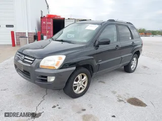 2007 Kia Sportage LX with VIN KNDJE723077397667, listed as a IAAI auction lot 42011122 with 218,744 mi miles. Bid and sale history available at carsss.com. Image 2.