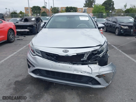 2019 Kia Optima LX with VIN 5XXGT4L3XKG285486, listed as a IAAI auction lot 41872981 with 101,981 mi miles. Bid and sale history available at carsss.com. Image 12.