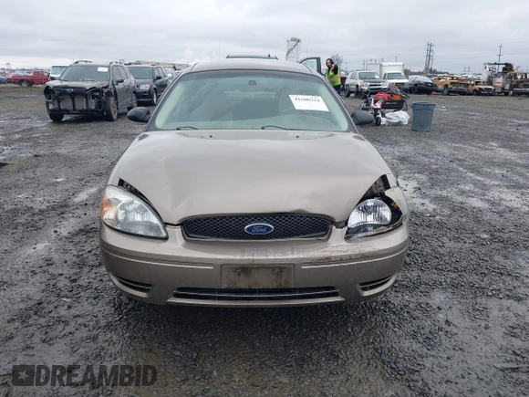 2006 Ford Taurus SE z VIN 1FAFP53U26A197294, wystawiony jako IAAI lot #41506334 z przebiegiem 180 411 mil mil oraz . Historia ofert i sprzedaży dostępna na DreamBid. Obrazek 12.