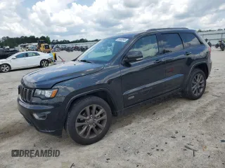 2016 Jeep Grand Cherokee Limited 75th Anniversary with VIN 1C4RJFBG0GC450516, listed as a Copart auction lot 59952665 with 128,557 mi miles and Salvage title. Bid and sale history available at DreamBid. Image 1.
