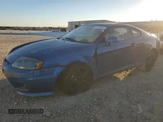 2005 Hyundai Tiburon GT z VIN KMHHN65F35U186438, wystawiony jako Copart lot #41879955 z przebiegiem 152 574 mil mil oraz Szkody całkowita. Historia ofert i sprzedaży dostępna na DreamBid. Obrazek 1.