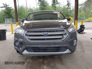 2017 Ford Escape SE z VIN 1FMCU9G93HUC97081, wystawiony jako IAAI lot #42327866 z przebiegiem 97 580 mil mil oraz . Historia ofert i sprzedaży dostępna na DreamBid. Obrazek 12.