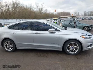 2015 Ford Fusion Titanium Hybrid with VIN 3FA6P0RU8FR181312, listed as a IAAI auction lot 42071584 with 99,955 mi miles. Bid and sale history available at carsss.com. Image 13.