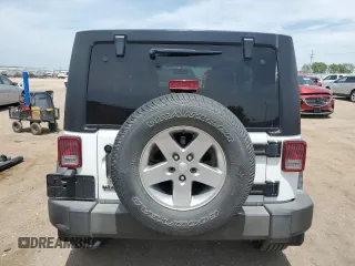 2015 Jeep Wrangler Unlimited Sport with VIN 1C4BJWDG2FL545561, listed as a Copart auction lot 60574045 with 83,592 mi miles and Salvage title. Bid and sale history available at DreamBid. Image 6.