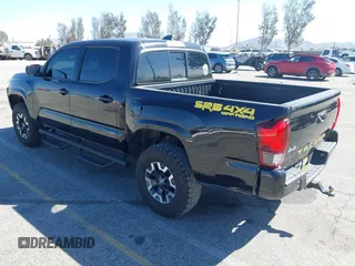 2018 Toyota Tacoma SR with VIN 3TMCZ5AN2JM127244, listed as a IAAI auction lot 41698199 with 61,535 mi miles and . Bid and sale history available at DreamBid. Image 3.