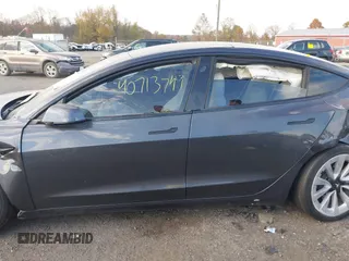 2021 Tesla Model 3 Long Range with VIN 5YJ3E1EB6MF975916, listed as a IAAI auction lot 40713749 with 29,593 mi miles and . Bid and sale history available at DreamBid. Image 13.