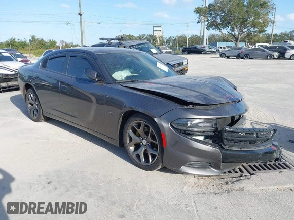 2015 Dodge Charger RT with VIN 2C3CDXCT9FH819971, listed as a IAAI auction lot 40592010 with 154,386 mi miles and . Bid and sale history available at DreamBid. Image 1.