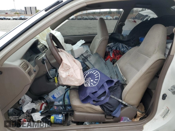 1996 Toyota Tercel DX z VIN JT2AC52L5T0145290, wystawiony jako Copart lot #45027855 z przebiegiem 186 673 mil mil oraz Szkoda całkowita • Salvage title. Historia ofert i sprzedaży dostępna na DreamBid. Obrazek 7.
