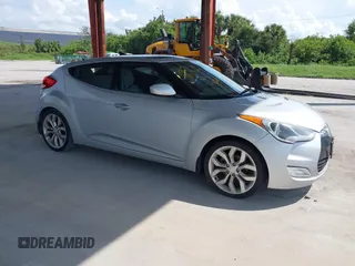 2012 Hyundai Veloster w/Gray Int z VIN KMHTC6ADXCU056898, wystawiony jako IAAI lot #40366687 z przebiegiem 137 161 mil mil oraz . Historia ofert i sprzedaży dostępna na DreamBid. Obrazek 1.