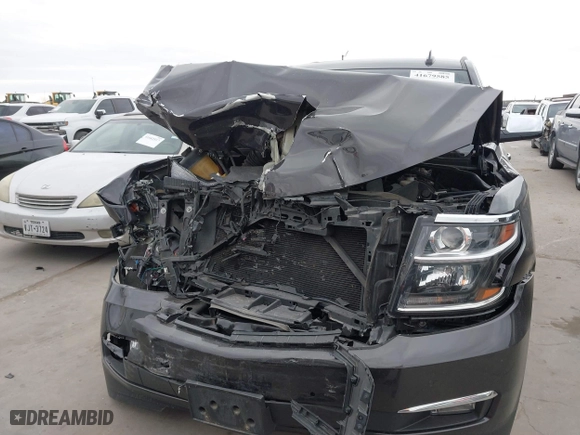 2015 Chevrolet Tahoe LTZ with VIN 1GNSCCKC7FR614886, listed as a IAAI auction lot 41679585 with 104,695 mi miles. Bid and sale history available at carsss.com. Image 12.