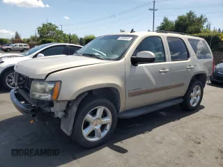2007 Chevrolet Tahoe LTZ with VIN 1GNFC13J27J132703, listed as a Copart auction lot 56989545 with 180,204 mi miles and Salvage title. Bid and sale history available at DreamBid. Image 1.