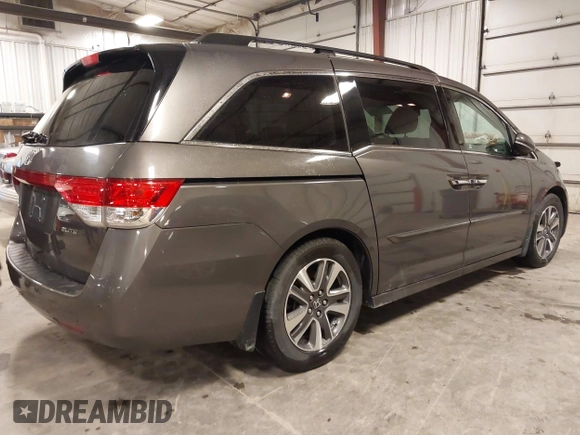 2016 Honda Odyssey Touring Elite with VIN 5FNRL5H92GB045824, listed as a IAAI auction lot 41872220 with 120,557 mi miles. Bid and sale history available at carsss.com. Image 4.