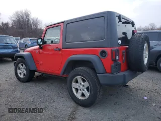 2015 Jeep Wrangler Willys Wheeler with VIN 1C4AJWAG9FL543998, listed as a Copart auction lot 88947025 with 142,433 mi miles and Salvage title. Bid and sale history available at DreamBid. Image 2.