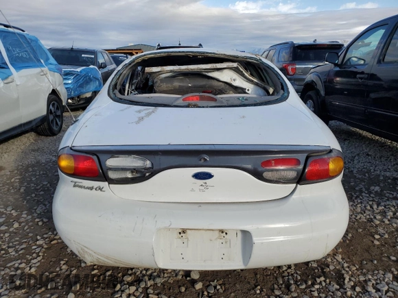 1997 Ford Taurus GL z VIN 1FALP52U1VG253340, wystawiony jako Copart lot #44081395 z przebiegiem 210 117 mil mil oraz Szkoda całkowita • Salvage title. Historia ofert i sprzedaży dostępna na DreamBid. Obrazek 6.