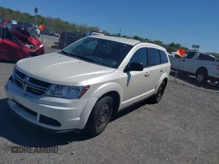 2014 Dodge Journey SE with VIN 3C4PDCAB9ET121415, listed as a IAAI auction lot 42138601 with 157,043 mi miles. Bid and sale history available at carsss.com. Image 2.