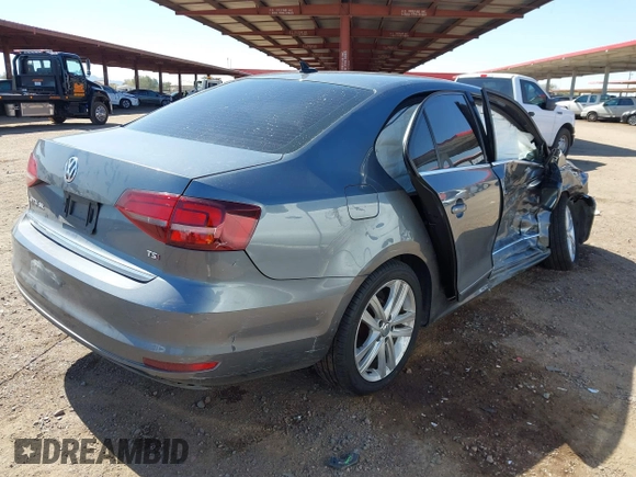 2017 Volkswagen Jetta SEL z VIN 3VWL17AJ6HM407708, wystawiony jako IAAI lot #41848360 z przebiegiem Nie podano mil oraz . Historia ofert i sprzedaży dostępna na DreamBid. Obrazek 4.