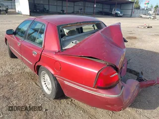 2000 Mercury Grand Marquis LS z VIN 2MEFM75W1YX736283, wystawiony jako IAAI lot #41879063 z przebiegiem 114 535 mil mil oraz . Historia ofert i sprzedaży dostępna na DreamBid. Obrazek 14.