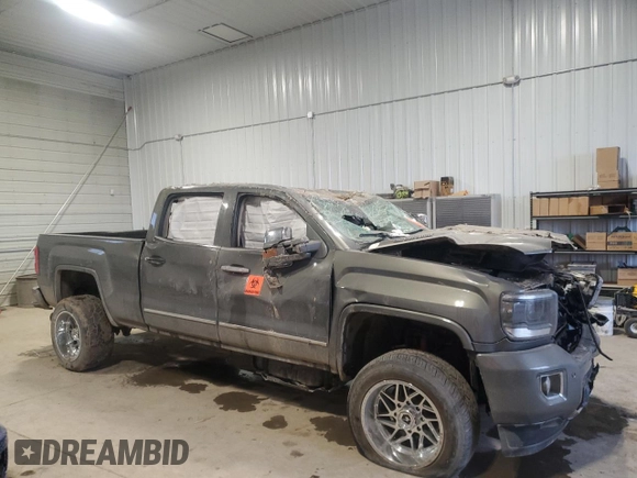 2018 GMC Sierra 2500HD Denali z VIN 1GT12UEY9JF121158, wystawiony jako Copart lot #87449504 z przebiegiem 170 506 mil mil oraz Szkoda całkowita • Salvage title. Historia ofert i sprzedaży dostępna na DreamBid. Obrazek 4.