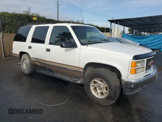 1999 GMC Yukon with VIN 1GKEK13RXXJ735870, listed as a Copart auction lot 44988505 with 150,557 mi miles and Salvage Title. Bid and sale history available at carsss.com. Image 4.