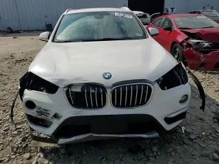 2017 BMW X1 xDrive28i z VIN WBXHT3C35H5F86099, wystawiony jako Copart lot #60196275 z przebiegiem 61 117 mil mil oraz Szkoda całkowita • Salvage title. Historia ofert i sprzedaży dostępna na DreamBid. Obrazek 14.