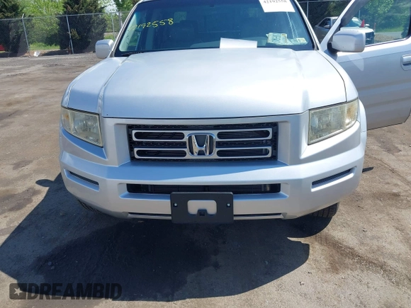 2007 Honda Ridgeline RTL z VIN 2HJYK16527H521549, wystawiony jako IAAI lot #42192558 z przebiegiem 227 162 mil mil oraz . Historia ofert i sprzedaży dostępna na DreamBid. Obrazek 6.