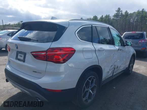 2019 BMW X1 xDrive28i with VIN WBXHT3C56K5L35842, listed as a IAAI auction lot 41981409 with 54,325 mi miles. Bid and sale history available at carsss.com. Image 4.
