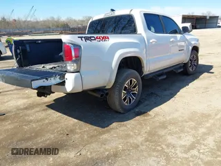 2022 Toyota Tacoma SR with VIN 3TMCZ5AN4NM470000, listed as a IAAI auction lot 41629818 with 78,138 mi miles and . Bid and sale history available at DreamBid. Image 4.