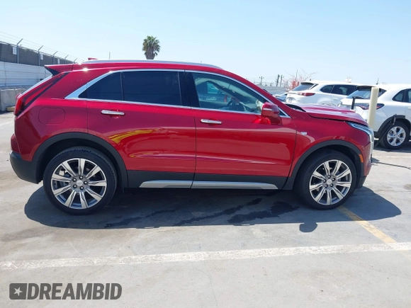 2021 Cadillac XT4 FWD Premium Luxury z VIN 1GYFZCR48MF004849, wystawiony jako IAAI lot #42131896 z przebiegiem 9 864 mil mil oraz . Historia ofert i sprzedaży dostępna na DreamBid. Obrazek 13.