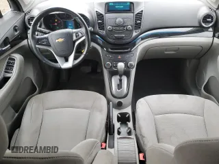 2012 Chevrolet Orlando 1LT z VIN KL77P2EM1CK550055, wystawiony jako Copart lot #77021754 z przebiegiem 127 987 mil mil oraz Szkody całkowita. Historia ofert i sprzedaży dostępna na DreamBid. Obrazek 8.