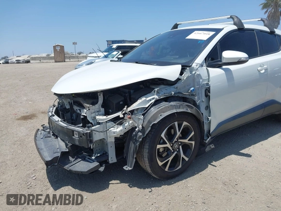 2018 Toyota C-HR XLE with VIN NMTKHMBX8JR036857, listed as a IAAI auction lot 42667018 with 63,058 mi miles and . Bid and sale history available at DreamBid. Image 6.