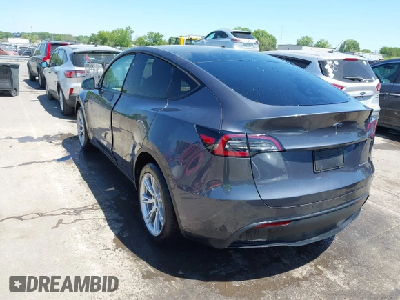 2023 Tesla Model Y Long Range with VIN 7SAYGDEE5PF882582, listed as a IAAI auction lot 42059015 with 10,567 mi miles and . Bid and sale history available at carsss.com. Image 3.