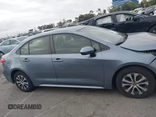 2022 Toyota Corolla Hybrid LE with VIN JTDEAMDE4NJ041913, listed as a IAAI auction lot 41883490 with 23,063 mi miles. Bid and sale history available at carsss.com. Image 13.