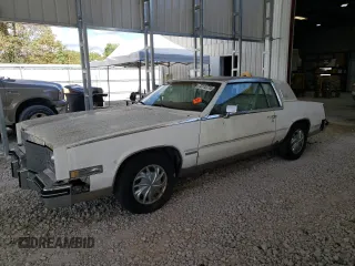 1983 Cadillac Eldorado z VIN 1G6AL5787DE628931, wystawiony jako Copart lot #73113774 z przebiegiem 28 559 mil mil oraz Tytuł czysty. Historia ofert i sprzedaży dostępna na DreamBid. Obrazek 1.