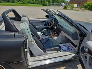 1999 Mercedes-Benz SL 500 with VIN WDBFA68FXXF184548, listed as a Copart auction lot 63814775 with 133,681 mi miles and Clean title. Bid and sale history available at DreamBid. Image 5.