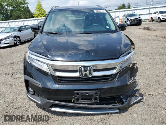 2020 Honda Pilot Touring 8-Passenger with VIN 5FNYF5H95LB021658, listed as a Copart auction lot 58878594 with 36,122 mi miles and Salvage Title. Bid and sale history available at DreamBid. Image 5.