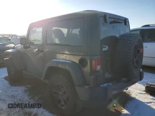 2017 Jeep Wrangler Willys Wheeler with VIN 1C4AJWAG2HL638213, listed as a Copart auction lot 88121675 with 62,760 mi miles and Salvage Title. Bid and sale history available at DreamBid. Image 2.