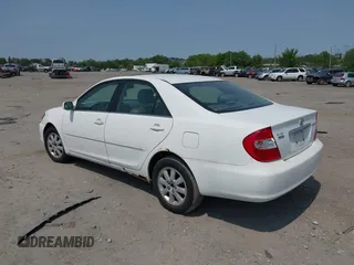 2002 Toyota Camry XLE z VIN 4T1BF30K22U007310, wystawiony jako IAAI lot #42419765 z przebiegiem 206 050 mil mil oraz . Historia ofert i sprzedaży dostępna na DreamBid. Obrazek 3.