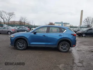 2019 Mazda CX-5 Sport with VIN JM3KFBBM5K0668678, listed as a IAAI auction lot 41811146 with 102,634 mi miles and . Bid and sale history available at DreamBid. Image 14.
