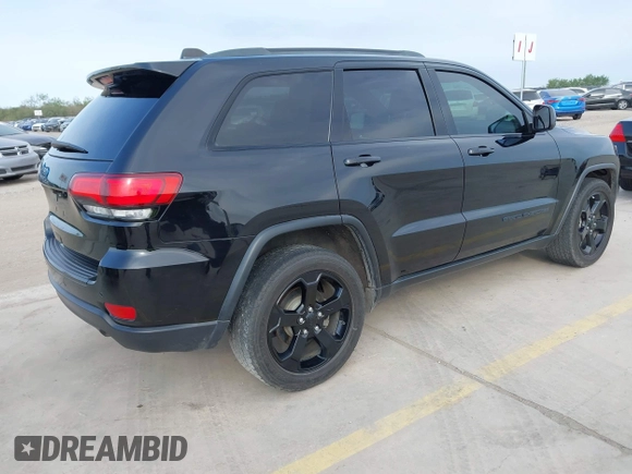 2018 Jeep Grand Cherokee Altitude with VIN 1C4RJFAG9JC436848, listed as a IAAI auction lot 42303459 with 124,044 mi miles and . Bid and sale history available at DreamBid. Image 4.
