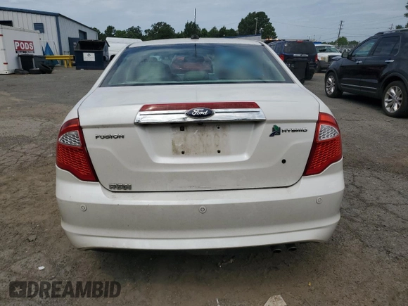 2012 Ford Fusion Hybrid с VIN 3FADP0L35CR184476, выставлен на аукционе Copart как лот 63907885 с пробегом 230 589 миль миль и Списание • Salvage title. История ставок и продаж доступна на DreamBid. Изображение 6.