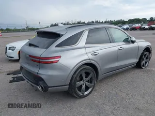 2023 Genesis GV70 Sport with VIN KMUMCDTC1PU098851, listed as a IAAI auction lot 41864774 with 15,016 mi miles and . Bid and sale history available at DreamBid. Image 4.