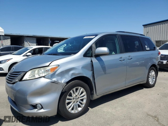 2014 Toyota Sienna XLE with VIN 5TDYK3DCXES496657, listed as a Copart auction lot 60498015 with 178,486 mi miles and Salvage title. Bid and sale history available at DreamBid. Image 1.