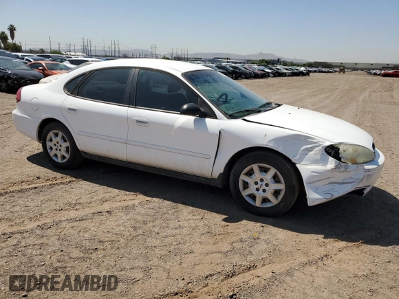 2006 Ford Taurus SE with VIN 1FAFP53UX6A194398, listed as a Copart auction lot 59582515 with 114,933 mi miles and Salvage title. Bid and sale history available at DreamBid. Image 4.