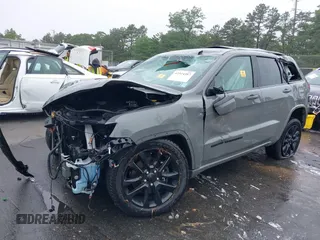 2021 Jeep Grand Cherokee Laredo X with VIN 1C4RJFAG2MC589415, listed as a IAAI auction lot 42514387 with 66,033 mi miles and . Bid and sale history available at DreamBid. Image 2.