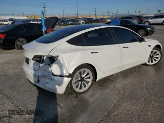 2021 Tesla Model 3 Standard Range Plus z VIN 5YJ3E1EA5MF018216, wystawiony jako Copart lot #52007385 z przebiegiem 49 711 mil mil oraz Szkoda całkowita • Salvage title. Historia ofert i sprzedaży dostępna na DreamBid. Obrazek 3.